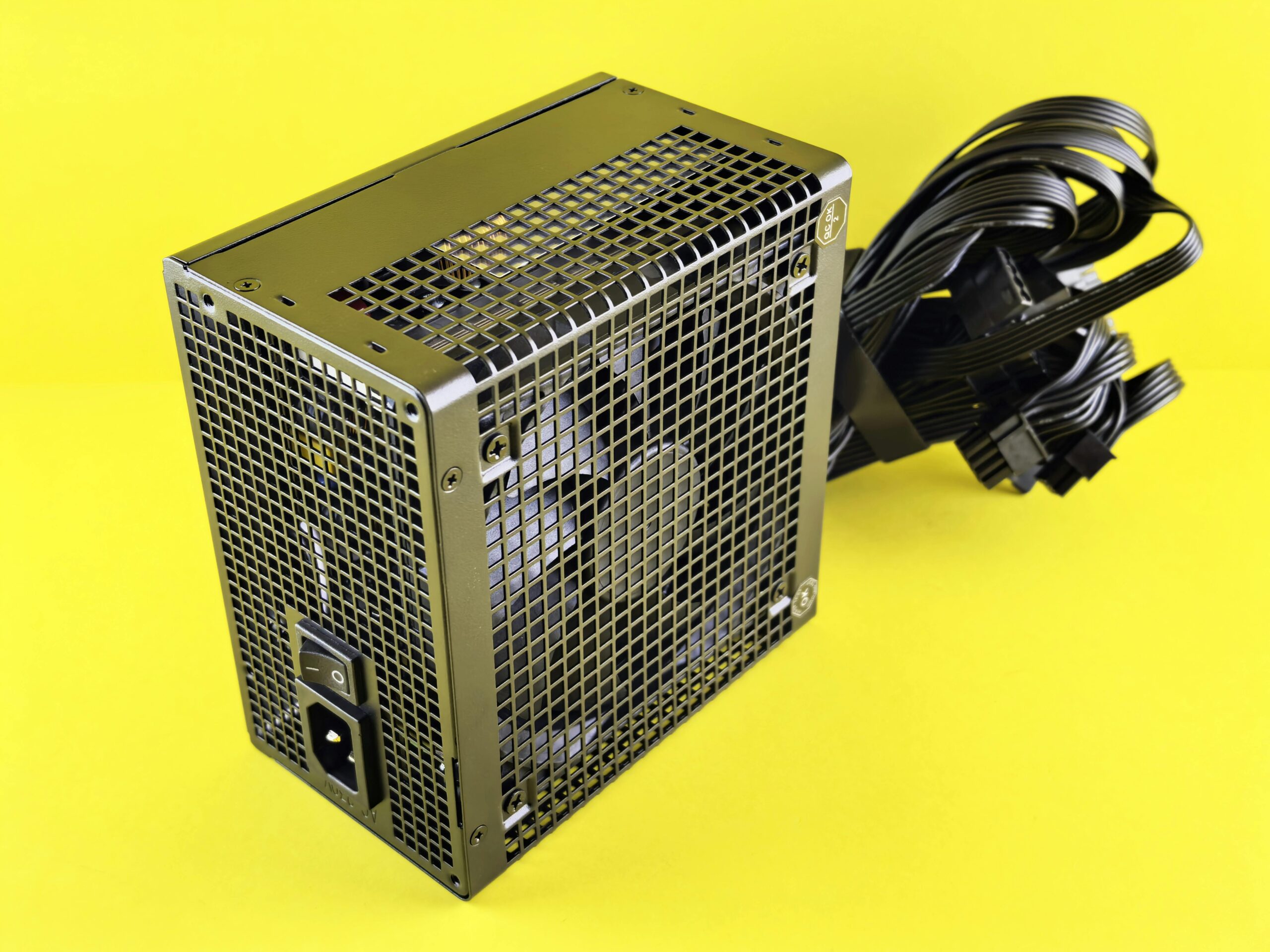 A powerful gaming PSU on yellow background, ideal for desktop setups.